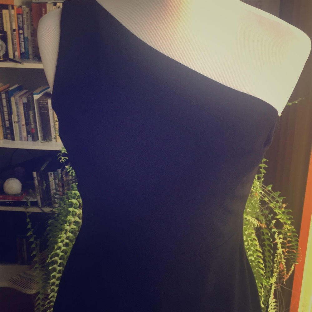 One shoulder black dress.